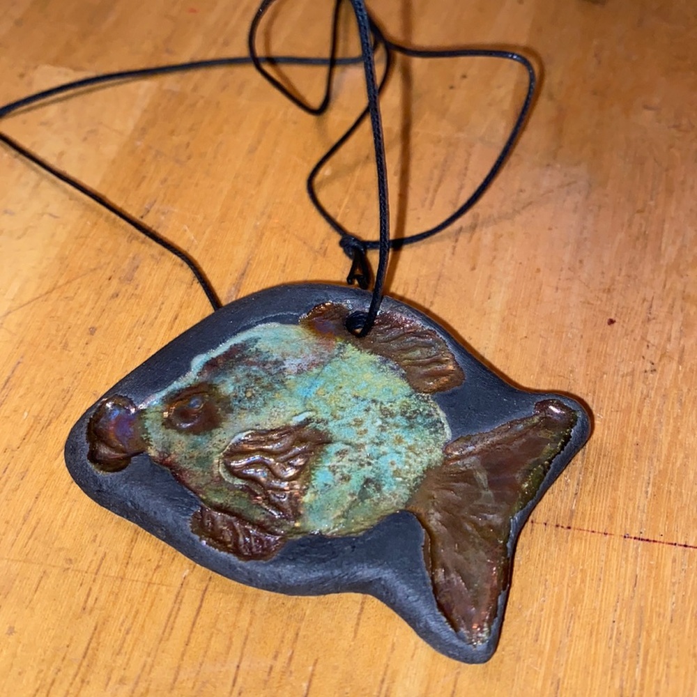 V! Mini pottery decor or necklace in great condition